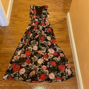 Dress- low cut dress with scrunched waist. Short underneath with sheer over it.